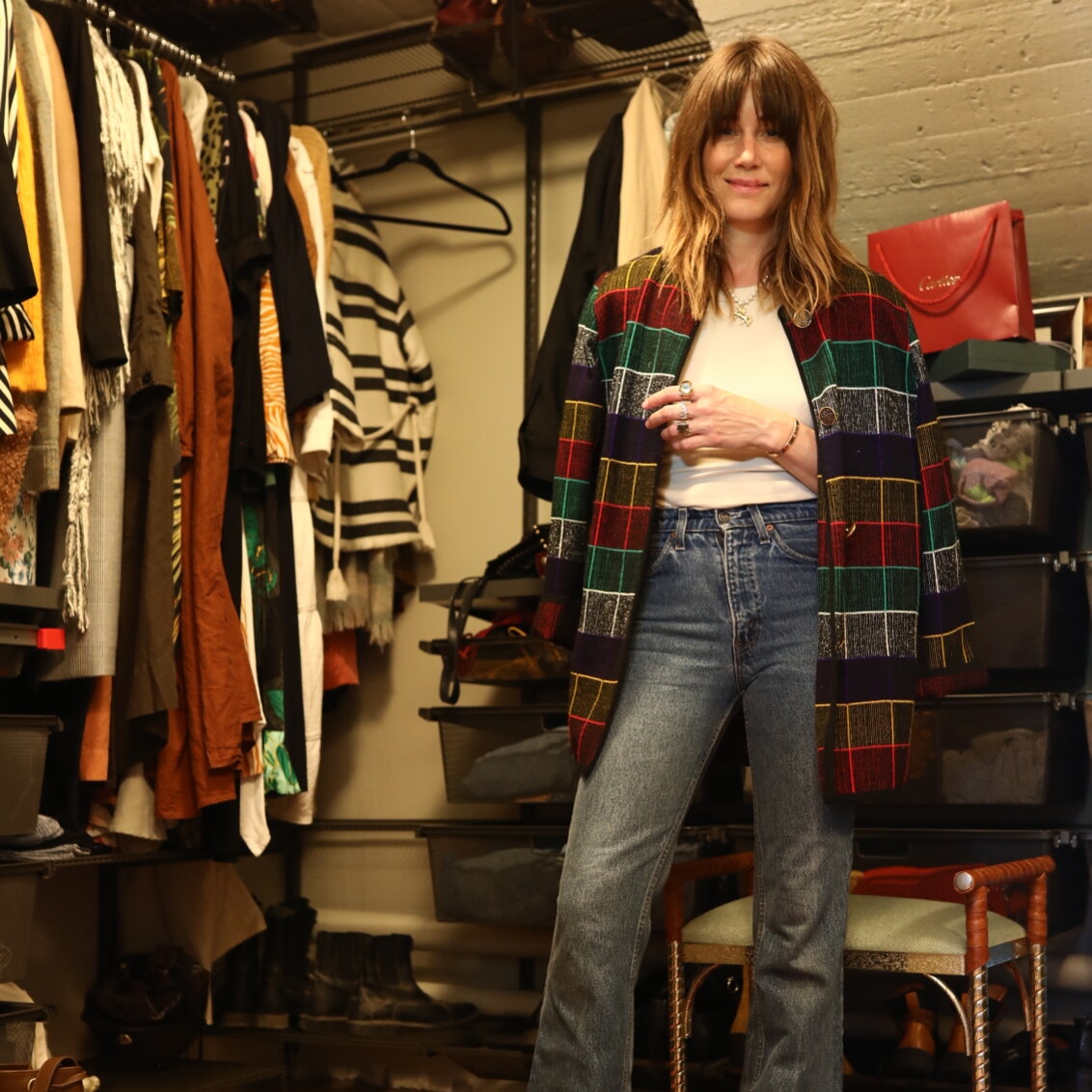 Cecilia Blankens in a walk-in closet with storage in grey from Classic by Elfa.