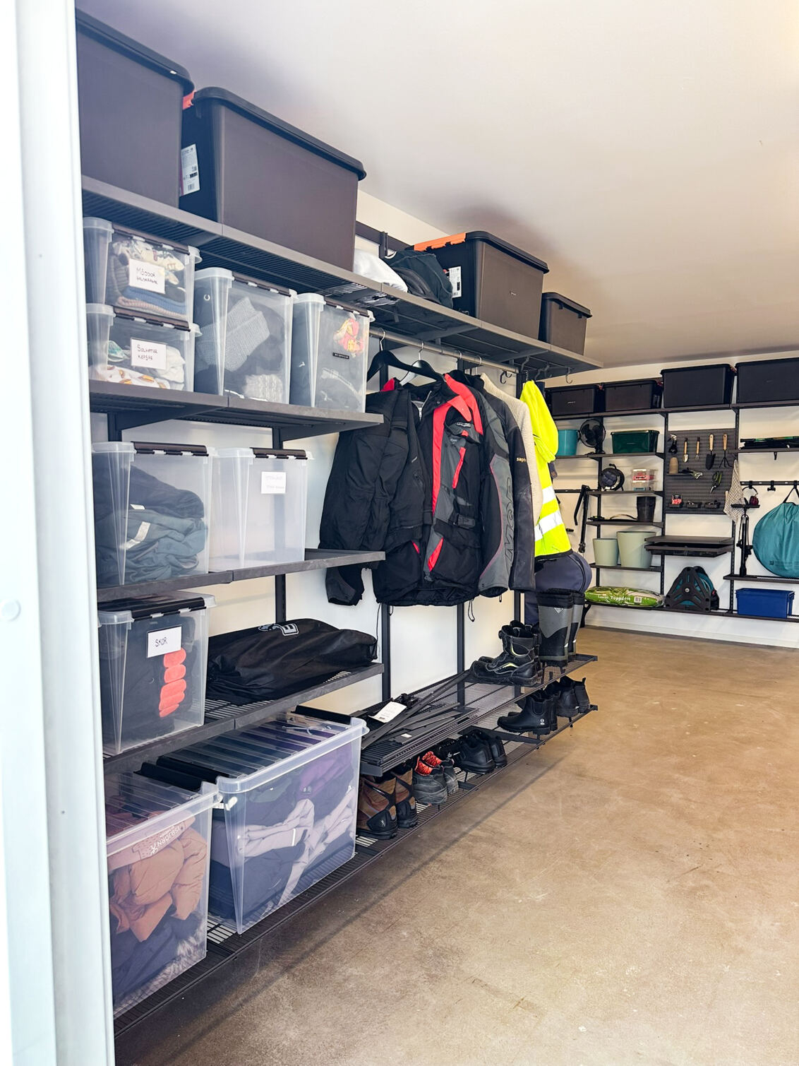 Garage with Garage+ by Elfa storage with shelves for storing clothes and shoes.
