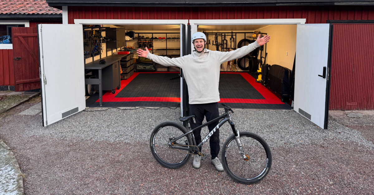 Martin Söderström outside his garage which contains Garage+ by Elfa storage, consisting of workbenches, cabinets and drawers.