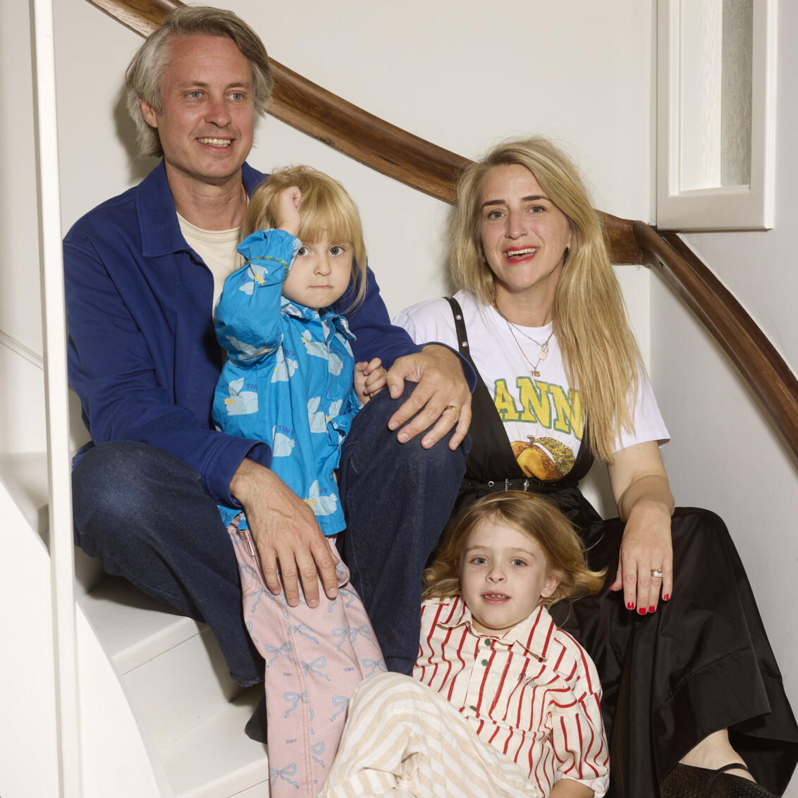 Caroline Richter and her family sitting together on a staircase.