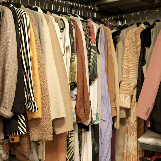 Elfa clothes rail with organised hanging garments