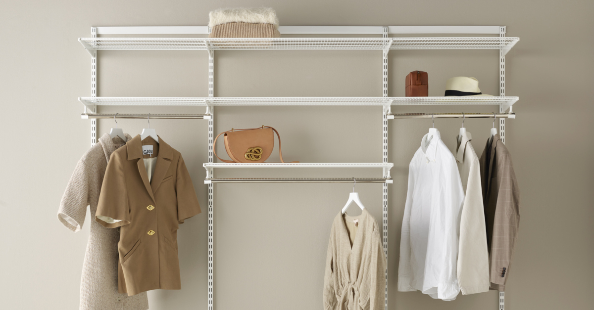 Open Classic by Elfa wardrobe in white with wire shelves and hanging clothes.