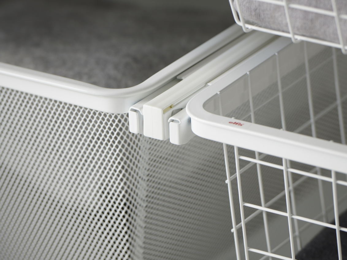 Wire drawer and mesh drawer from Classic by Elfa attached to a bracket.