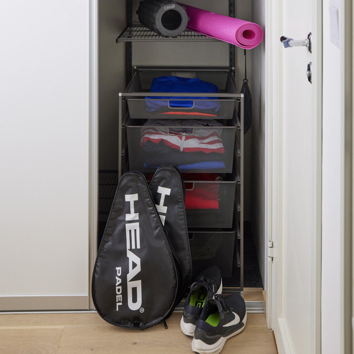 Open wardrobe with sports equipment with sliding doors Grace.
