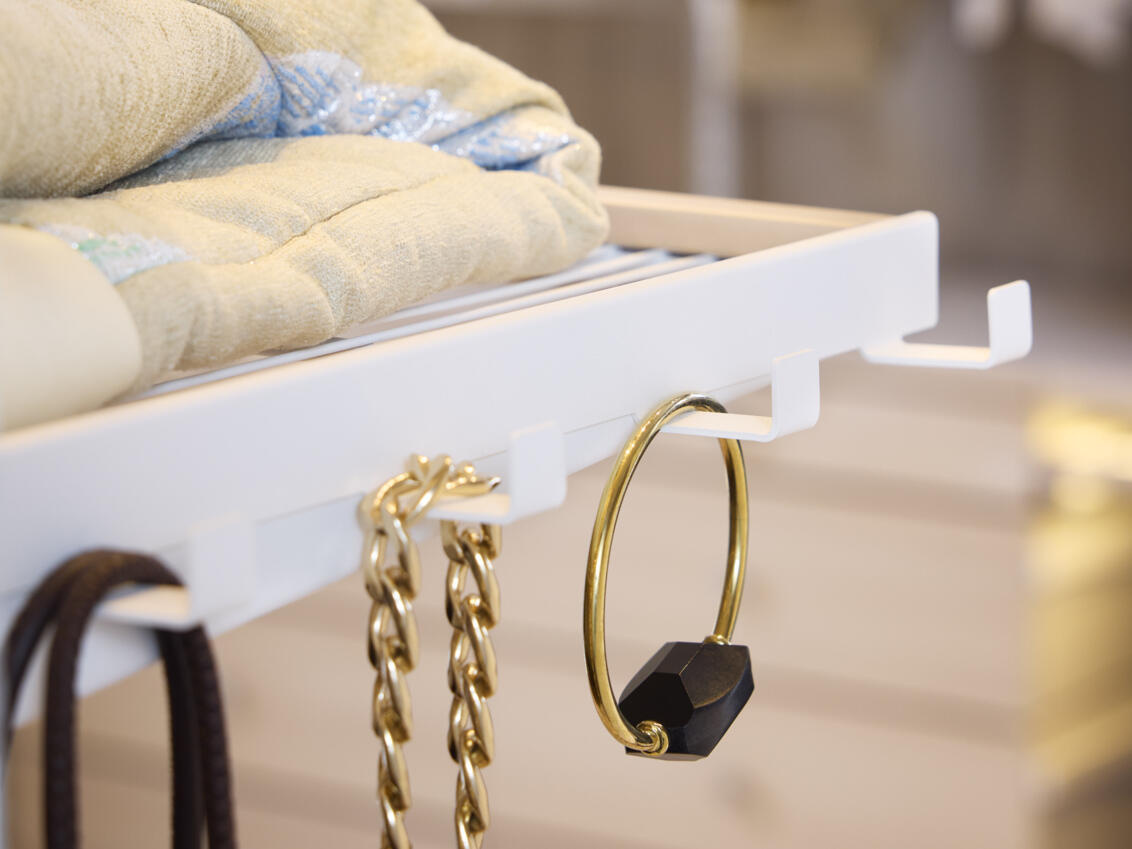 Bracket hook rack from Décor+ by Elfa in white where jewellery hangs.
